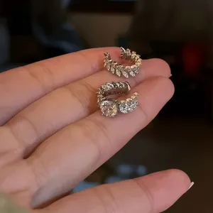 Sparkling CZ flower leaf ear cuffs set for non-pierced ears, silver finish close-up.