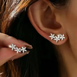 Elegant silver flower ear climber earrings set with sparkling cubic zirconia stones