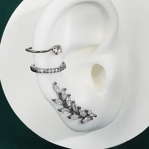 Sparkling silver zircon ear cuff and leaf flower stud earring set shown on ear model