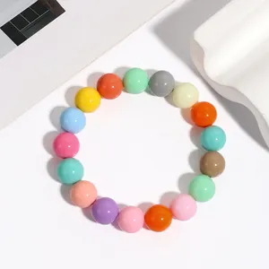 Detailed close-up view of a colorful acrylic bead elastic bracelet on white background