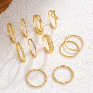 Elegant collection of vintage gold-tone rings with textured and crystal details