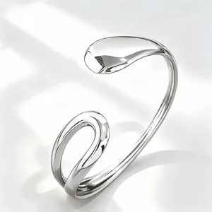 Detail view of minimalist silver geometric open cuff bracelet with sleek polished finish