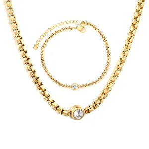 Set di gioielli vintage in acciaio dorato con collana e bracciale con cristallo tondo
