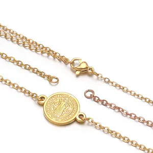 Detailed view of gold stainless steel St. Benedict medal pendant with lobster clasp and chain