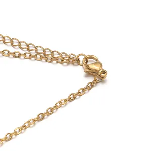Macro detail of a high-quality gold-plated stainless steel lobster clasp and chain