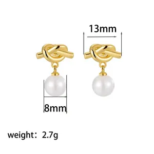 Elegant gold-tone knot stud earrings with white pearl drops including dimension markings