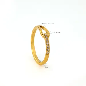 Close-up of minimalist gold U-shape titanium steel ring with pavé stones and dimensions
