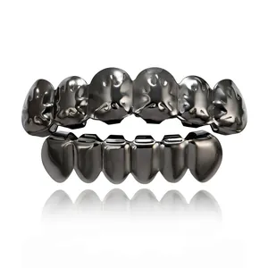 Hip-hop grillz set in gunmetal grey with textured top teeth on white background