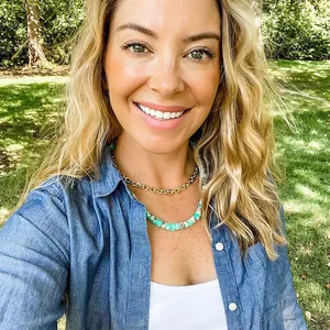 Blogger style detail showing natural semi-precious stone beaded necklace on model