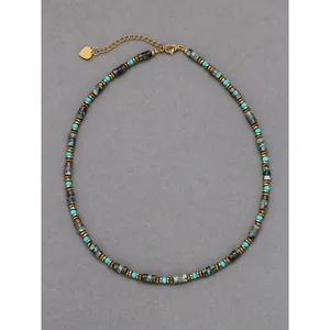 Detailed shot of a natural semi-precious stone beaded necklace with turquoise accents.