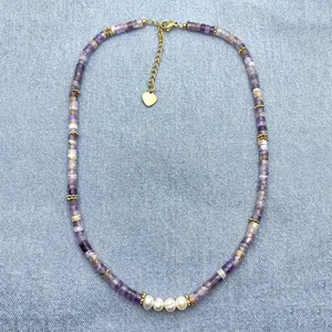 Detailed view of handmade purple amethyst bead necklace with white freshwater pearls