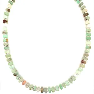 Close-up of natural green semi-precious stone beaded necklace with silver spacers