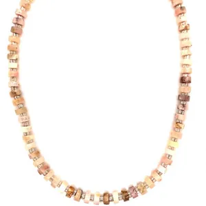 Macro view of natural semi-precious stone beaded necklace showing earthy textures