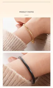 Close-up detail of gold and black stainless steel square snake chain bracelets