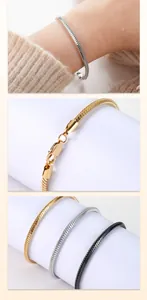 Detailed view of stainless steel square snake chain bracelets in gold, silver, and black