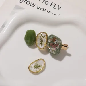 DIY hair clip accessory set with green stones and dried leaf resin drops