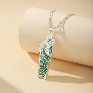 Close-up of silver-plated St. Jude pendant with sparkling green zircon micro-inlays
