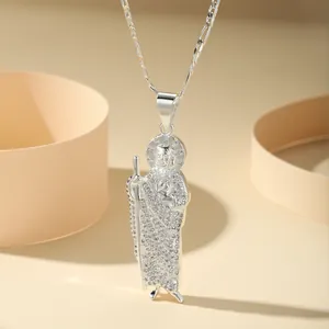 Detailed macro view of silver Saint Jude Thaddeus pendant with sparkly CZ stones.
