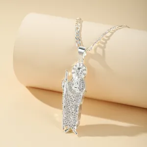 Detail shot of a silver San Judas Tadeo pendant with micro-set shimmering zircons