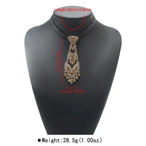 Gold-tone tie-shaped pendant necklace featuring amber crystals and size annotations