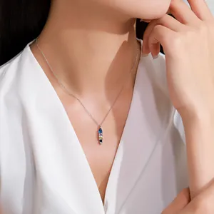 Elegant 925 sterling silver necklace with colorful geometric zircon pendant on model