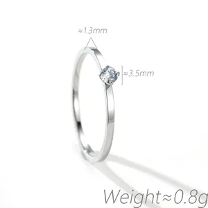 Close-up of minimalist solitaire ring showing 3.5mm cubic zirconia and slim 1.3mm band