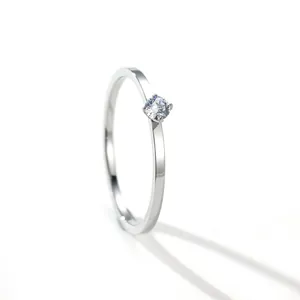 Close-up of minimalist titanium steel ring with round zircon stone inlay
