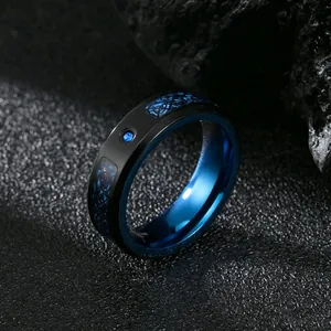 Macro detail of men's black ring with blue dragon pattern and zircon inlay