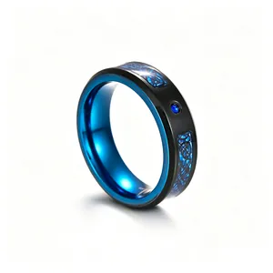 Macro view of men's black and blue dragon pattern ring with inlaid blue zircon detail