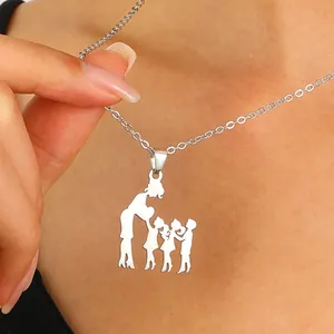 Detailed close-up of a stainless steel family pendant necklace on a woman's neck