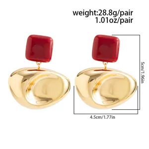 Detail view of French vintage oversized gold and red earrings with size specifications