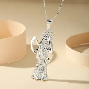 Close-up of silver-colored Santa Muerte scythe pendant with sparkling cubic zirconia