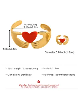 Gold metal bracelet and ring set featuring a red heart hand design with dimensions