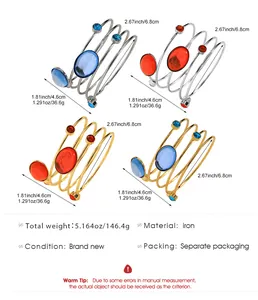 Detailed size and weight chart for spiral metal bangles with red and blue gemstones