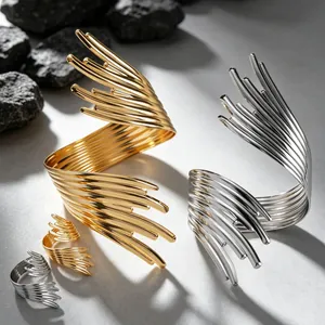 Sculptural geometric metal cuff and ring set in gold and silver finish