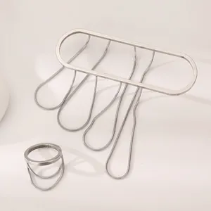 Geometric silver metal bangle and ring jewelry set with elegant snake chain fringes.