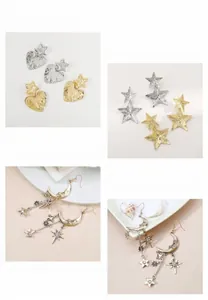 Primo piano di orecchini pendenti vintage con stelle e luna in finitura oro e argento