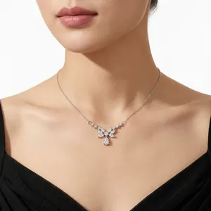 Elegant silver moissanite butterfly pendant necklace displayed on a female model's neck