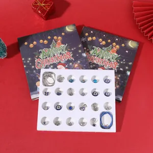 DIY Christmas jewelry advent calendar set featuring charms and bracelets in a gift box