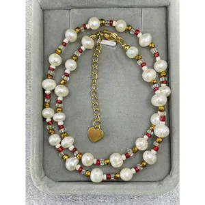 Close-up detail of Bohemian choker with irregular freshwater pearls and colorful beads.