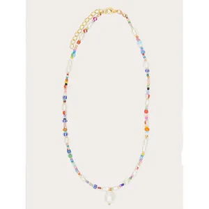 Close-up view of bohemian rainbow seed bead necklace with irregular freshwater pearls