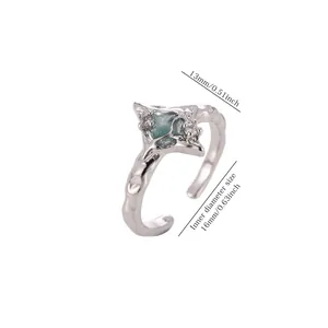 Detail view showing dimensions of textured silver geometric ring with blue stone