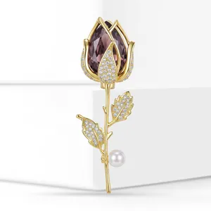 Exquisite detail of a gold-plated tulip brooch featuring micro-pave zircons and pearl