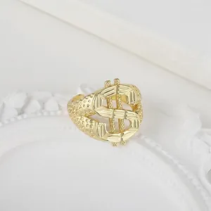 Macro view of a gold hip-hop ring featuring a bold dollar sign design with detailed texture