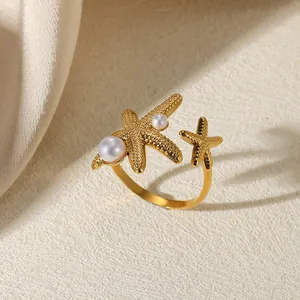 Detailed view of a French retro stainless steel ring with starfish and pearls.