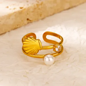 Detailed view of vintage gold stainless steel double band ring with shell and pearl