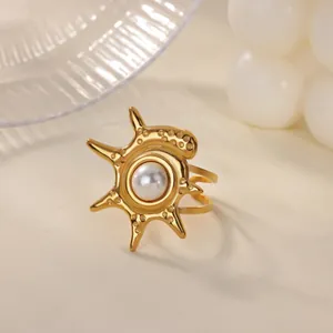 Detailed macro view of a vintage French style gold stainless steel ring with pearl