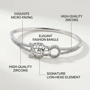 Detail of silver-plated panther bangle with micro-paved zircons and green eyes