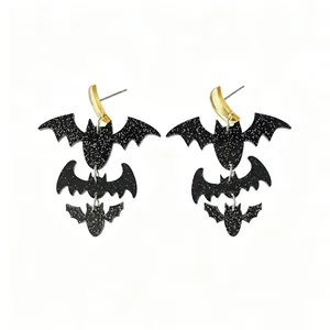 Spooky Halloween tiered black glitter bat earrings made of acrylic with gold crescent tops