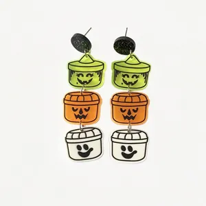 Detailed view of Halloween acrylic earrings featuring colorful tiered pumpkin faces
